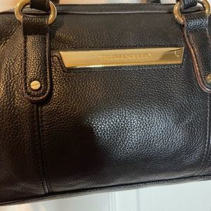 Tignanello black leather crossbody bag with gold tone hardwares.